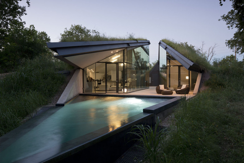 house-built-into-hill-moonlit-pool-front